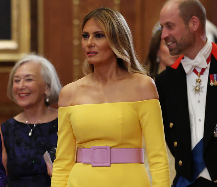 Melania Trump in a yellow dress and pink belt attending a formal event amid viral images of her documentary truth.