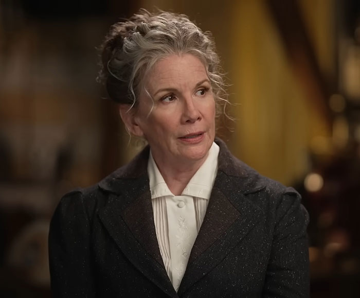 Melissa Gilbert looking thoughtful indoors, related to news about husband Timothy Busfield surrendering to police.