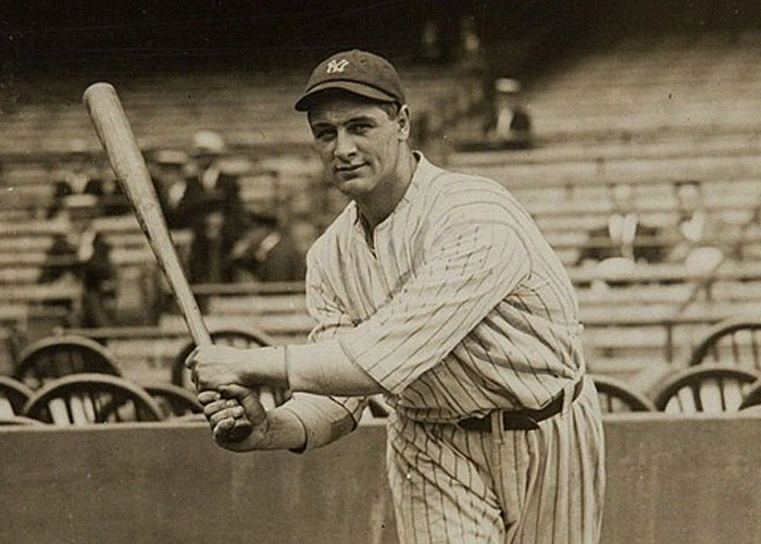 Vintage photo of a baseball player holding a bat on the field, illustrating ironic ways people passed away.