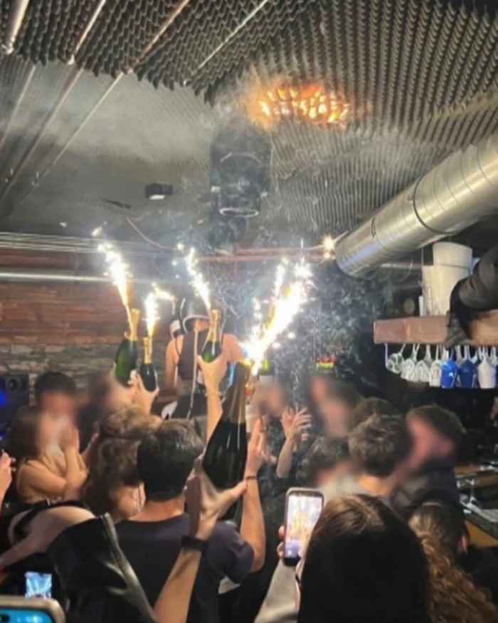 Crowd celebrates inside a Swiss resort with champagne and sparklers shortly before the horrific blaze that claimed nearly 50 lives. Crowd celebrates inside a Swiss resort with champagne and sparklers shortly before the horrific blaze that claimed nearly 50 lives.