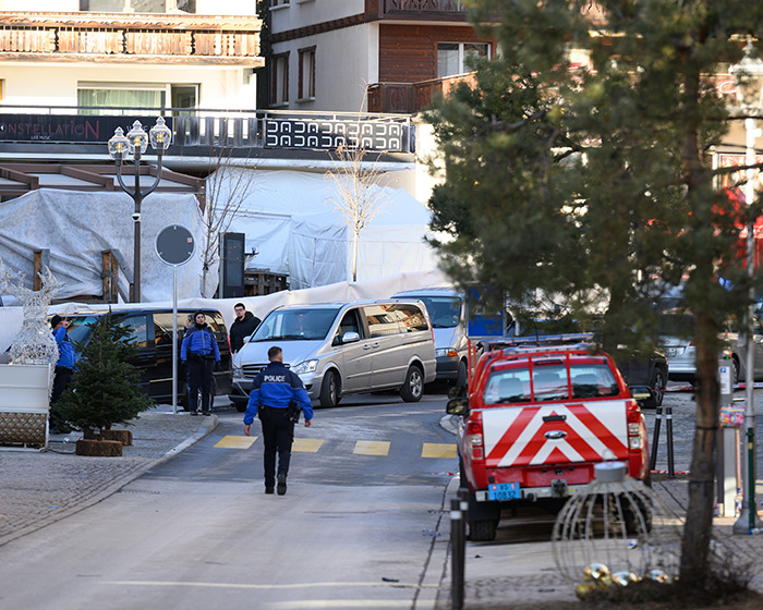 Police and emergency vehicles at the scene of the horrific Swiss resort blaze claiming nearly 50 lives Police and emergency vehicles at the scene of the horrific Swiss resort blaze claiming nearly 50 lives