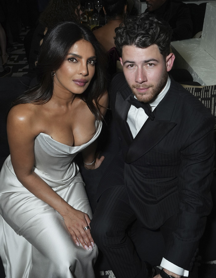 Nick Jonas and Priyanka Chopra dressed elegantly at an event, highlighting the Golden Globes 2026 atmosphere.