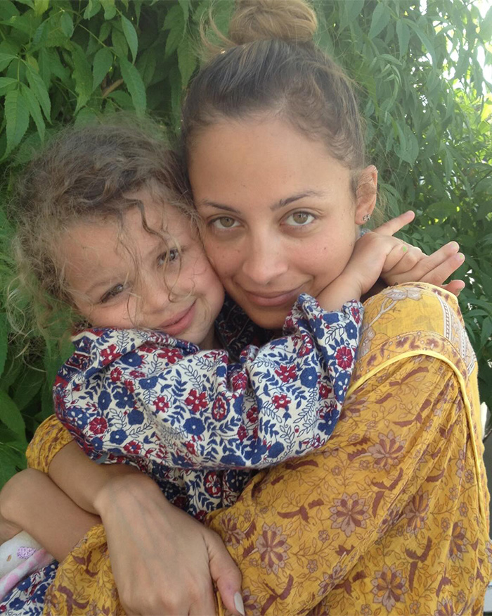 Nicole Richie hugging her daughter outdoors, revealing her 18-year-old daughter now goes by a new name.