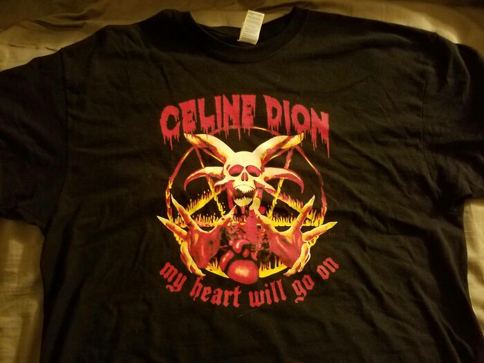 Black T-shirt with a horror-themed design and distorted text, showcasing one of the most hilarious fashion fails. Black T-shirt with a horror-themed design and distorted text, showcasing one of the most hilarious fashion fails.