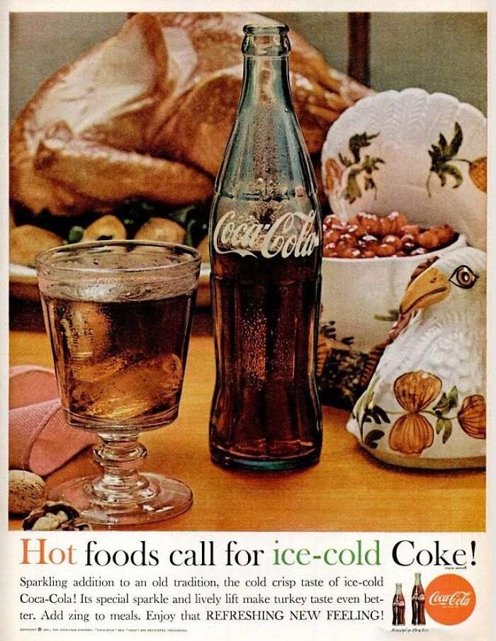 Vintage Coca-Cola ad featuring a bottle and glass promoting ice-cold Coke with a traditional holiday meal backdrop.
