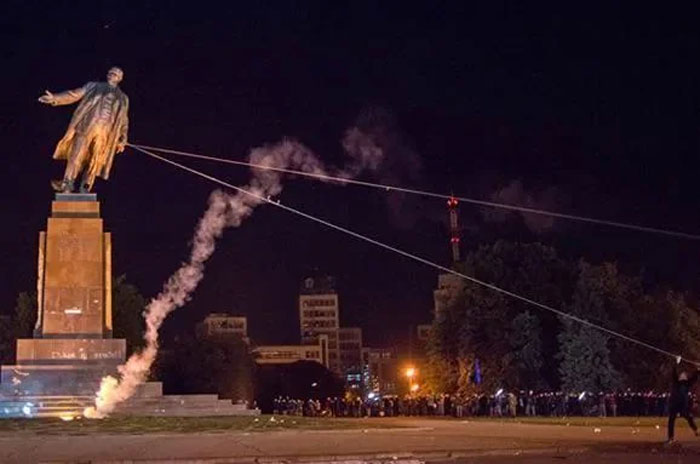 Protesters pulling down a statue at night, a powerful photo shared from their country that hits hard.
