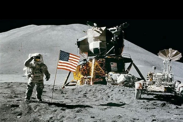 Astronaut on the moon next to the United States flag during a historic space mission, symbolizing exploration and achievement.