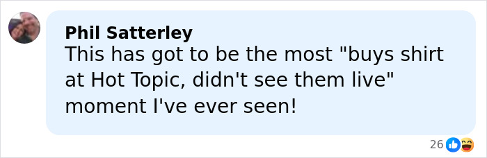 Facebook comment by Phil Satterley reacting humorously, referencing a Hot Topic shirt moment with emojis.