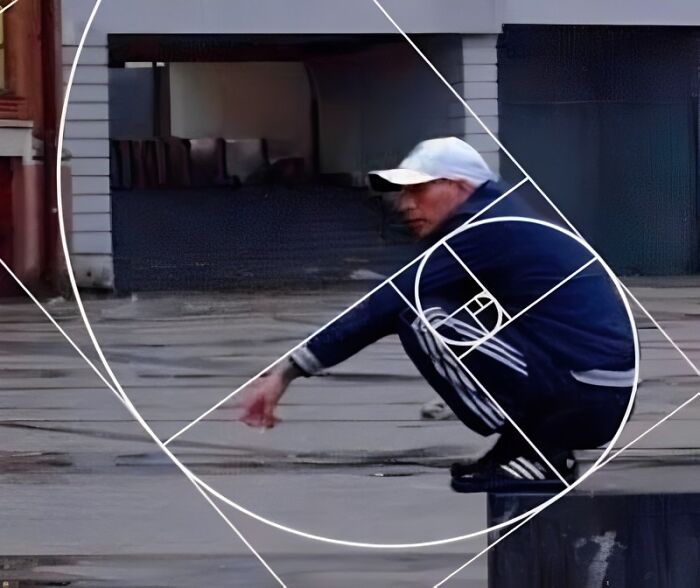 Man squatting in Adidas tracksuit and cap outdoors, illustrating funny Eastern European experience meme culture.