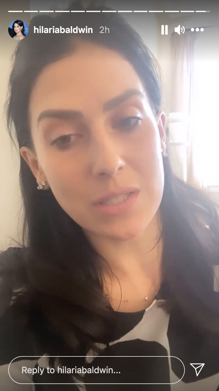 Close-up of a woman speaking in a casual indoor setting, illustrating pop culture moments that made people cringe hard.