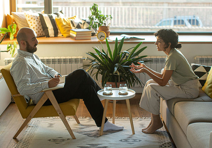 Two professionals engaged in a deep conversation, sharing insights about jobs the general public doesn’t know.