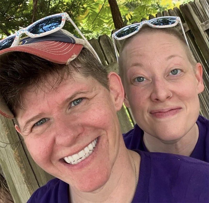 Couple outdoors wearing sunglasses, representing Renee Good&rsquo;s wife breaking silence on fatal ICE incident in community.