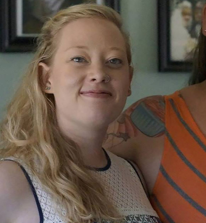 Woman identified as mom of a 6-year-old slain by ICE in her car in Minneapolis, smiling with long blonde hair indoors.