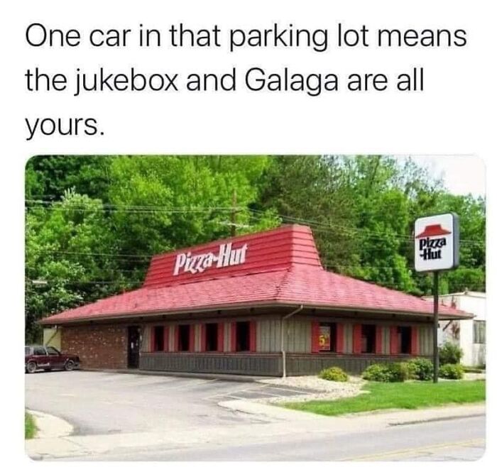 Empty Pizza Hut parking lot meme about restaurant workers enjoying quiet shifts with jukebox and arcade games.