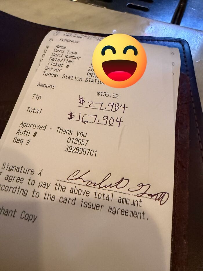 Handwritten tip amount on a restaurant receipt showing an exaggerated tip, relatable to restaurant workers and memes.