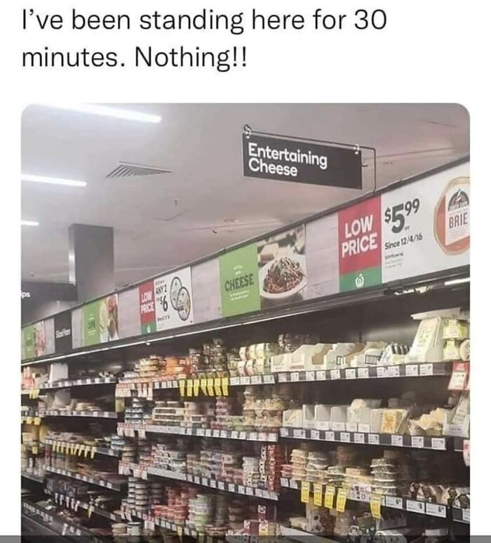 Grocery store cheese aisle with signs and humorous text relatable to restaurant workers' daily struggles.