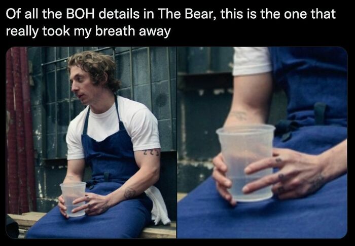 Restaurant worker in a blue apron holding a plastic cup of water, reflecting the realities restaurant workers relate to.