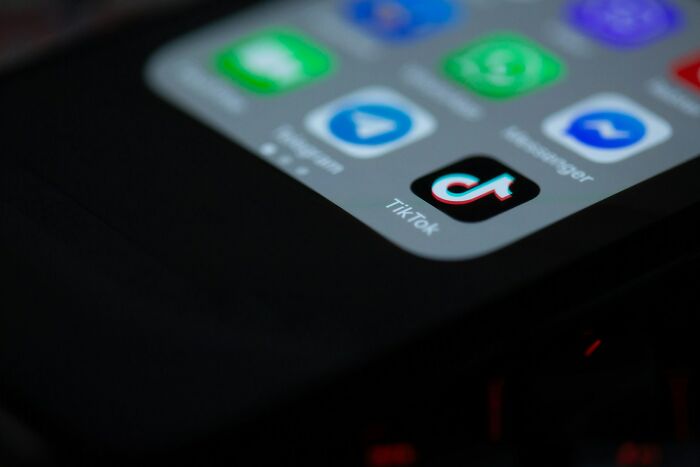Close-up of a smartphone screen showing social media apps, highlighting daily dangers you might not realize online.