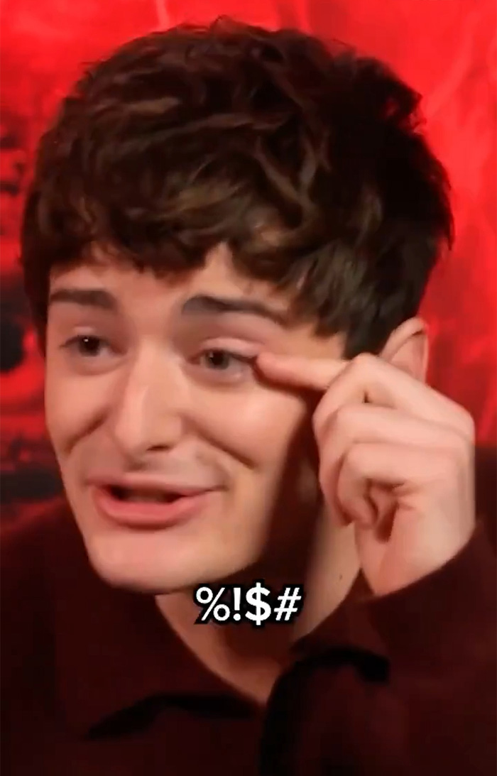 Noah Schnapp from Stranger Things making a facial gesture during an interview with a red background. Noah Schnapp from Stranger Things making a facial gesture during an interview with a red background.