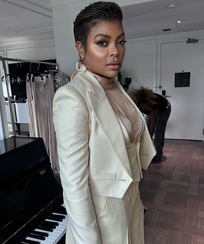 Taraji P. Henson posing indoors in cream suit with earrings, sparking fan concern over her face changes and appearance.