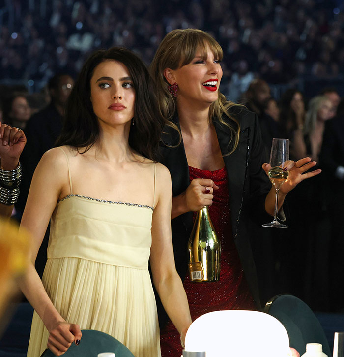 Two women at an award show event, one holding a champagne bottle and glass, highlighting strict rules celebrities follow.