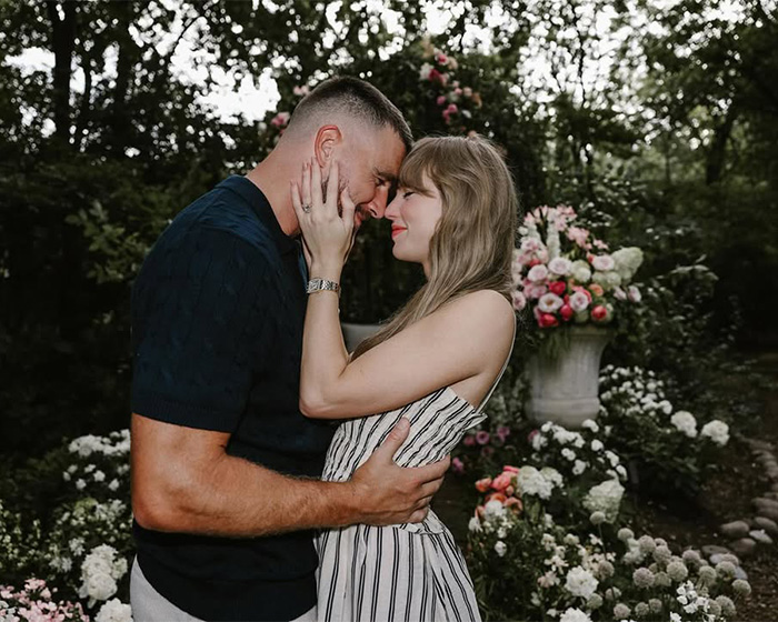 Taylor Swift and Travis Kelce embracing in a garden, highlighting the potential impact of Blake Lively on their wedding plans.