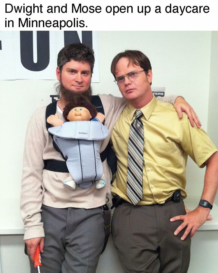 Dwight and Mose from The Office dressed up, with Mose carrying a doll in a baby carrier in a humorous meme.