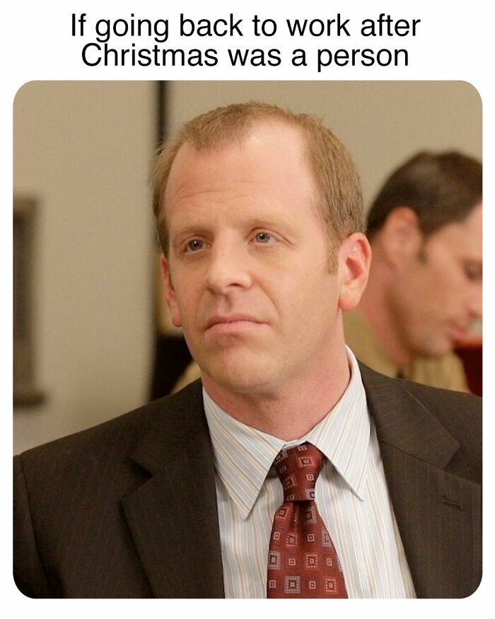 Unimpressed man in a suit from The Office meme about going back to work after Christmas, inspired by TV series humor.