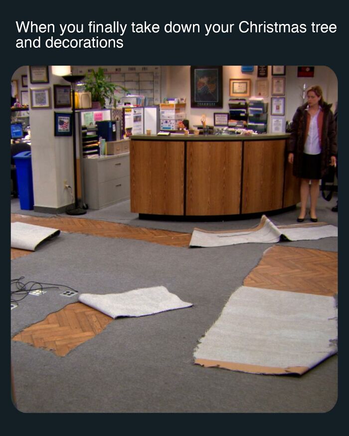 Office scene with torn carpet and a woman standing, a popular meme inspired by the TV series The Office.