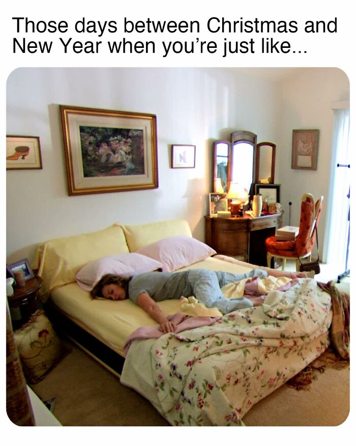 Person lying face down on a bed in a cozy bedroom, capturing a relatable moment from The Office memes.
