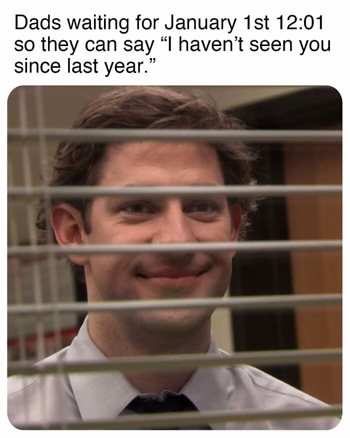 Man smiling behind office blinds in a meme inspired by the TV series The Office, showcasing humorous dad behavior.