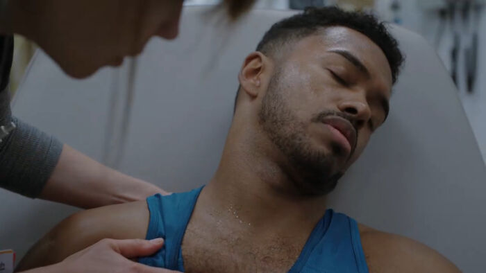 Patient with shoulder pain exam by doctor in clinical setting showing realistic medical cases from The Pitt