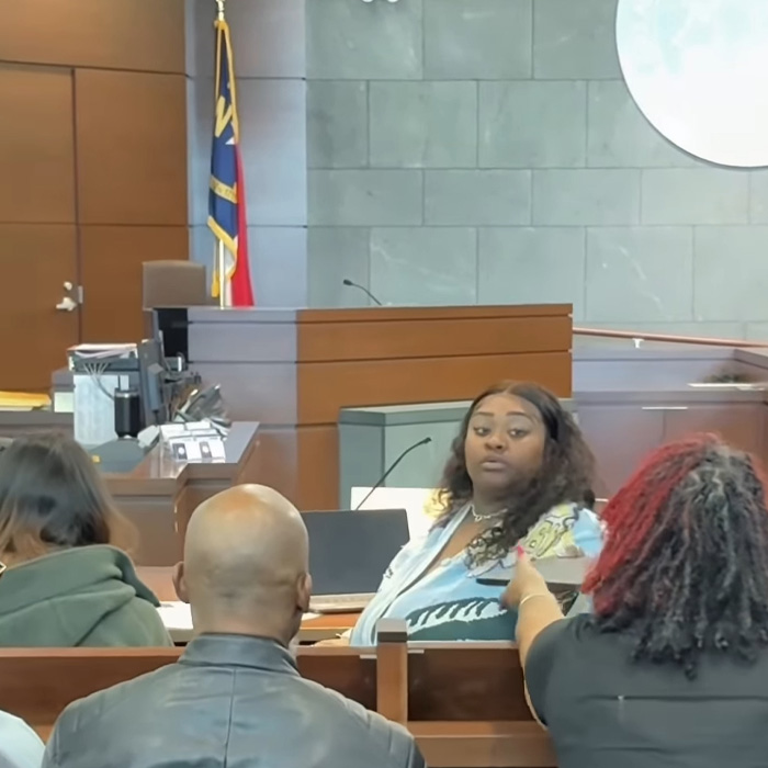 TikTok influencer in a courtroom scene facing legal action after admitting inappropriate act in couple&rsquo;s home.
