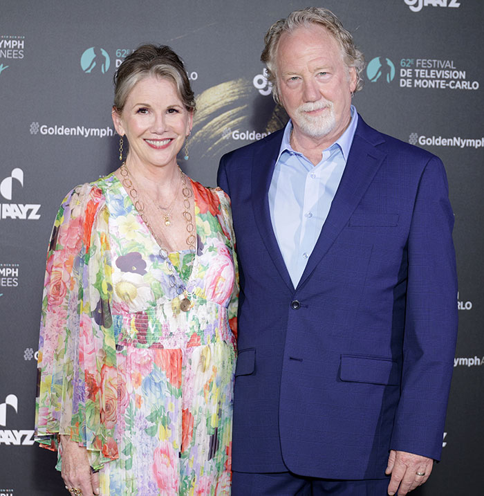 Melissa Gilbert and Timothy Busfield posing together at a formal event amid police surrender news.
