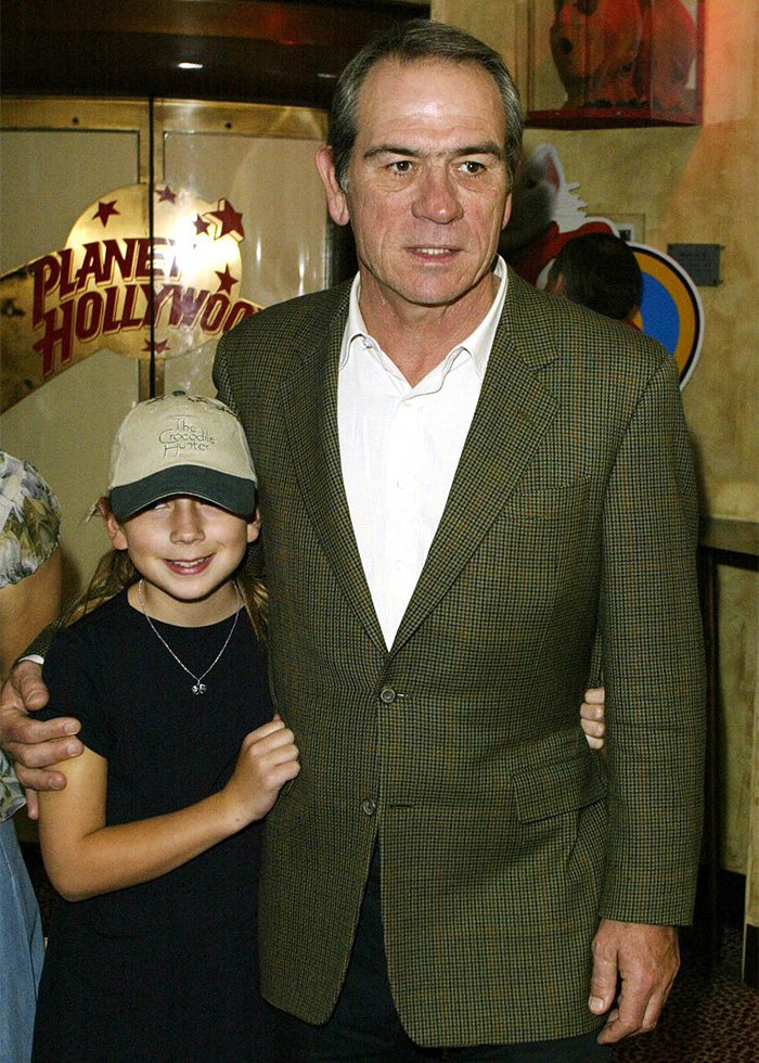 Tommy Lee Jones standing with a young girl at Planet Hollywood event, highlighting mystery surrounding Victoria's passing details