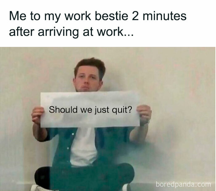 Man sitting holding a sign saying Should we just quit, a relatable works meme about workplace humor and stress.