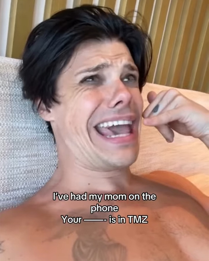 Yungblud reacting shirtless indoors, discussing consequences of stripping down on yacht after viral stunt.