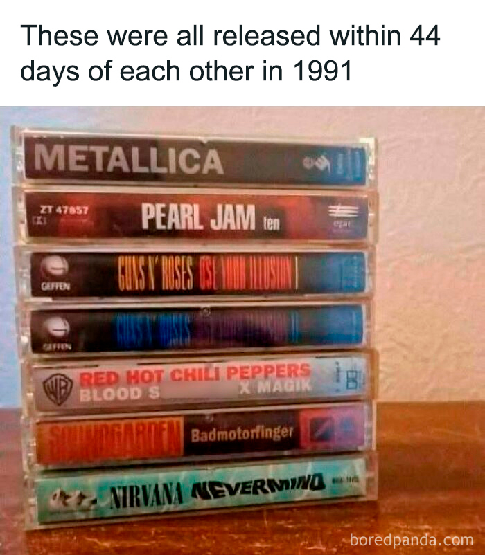 Stack of nostalgic 1991 cassette tapes from Metallica, Pearl Jam, Guns N' Roses, and Nirvana for Gen X music fans.