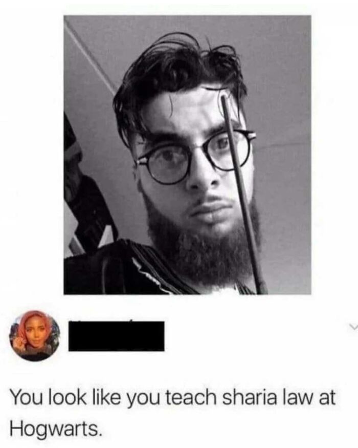 Young man with glasses and beard holding a wand, featured in a random meme with an entertaining and unhinged vibe.
