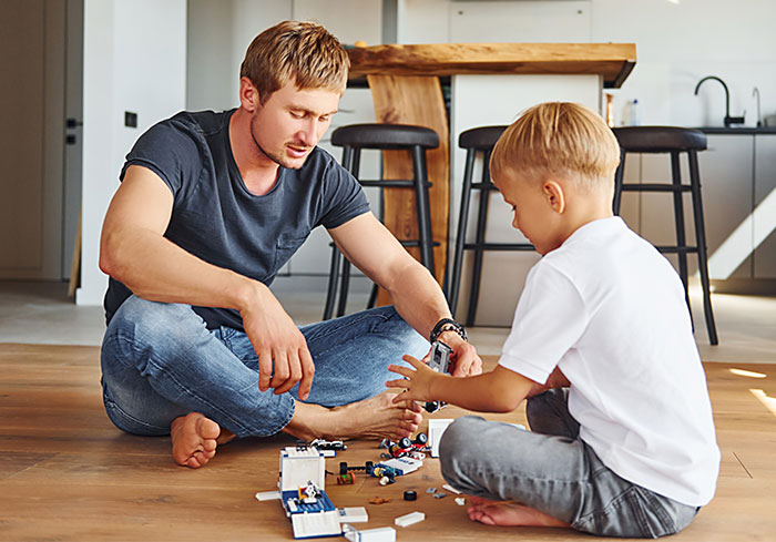 Man and child playing with expensive Lego sets at home, as cheating ex-wife's boyfriend steals and gets arrested.