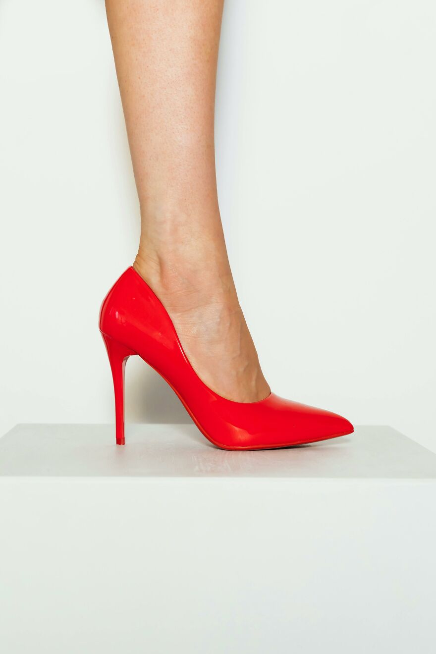 Woman wearing bright red high heel shoe demonstrating everyday items take on new life with creative hacks.