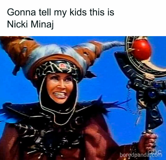 Woman in an elaborate fantasy costume with twisted horns and staff, featured in hilarious memes that don't explain themselves.