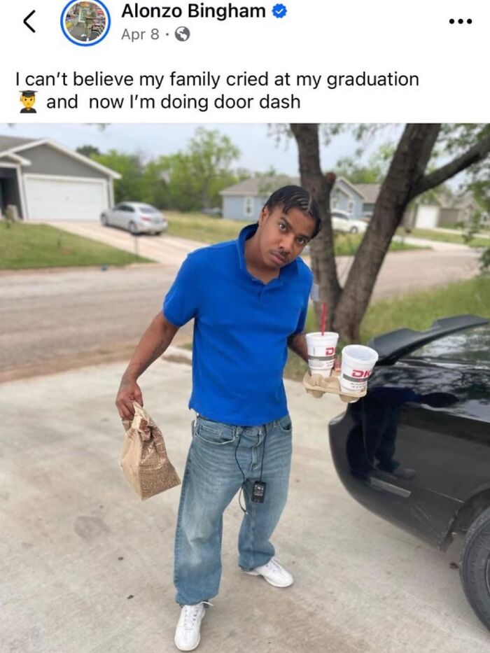Man holding food and drinks for delivery outside near a car, illustrating random memes that are entertaining and unhinged.