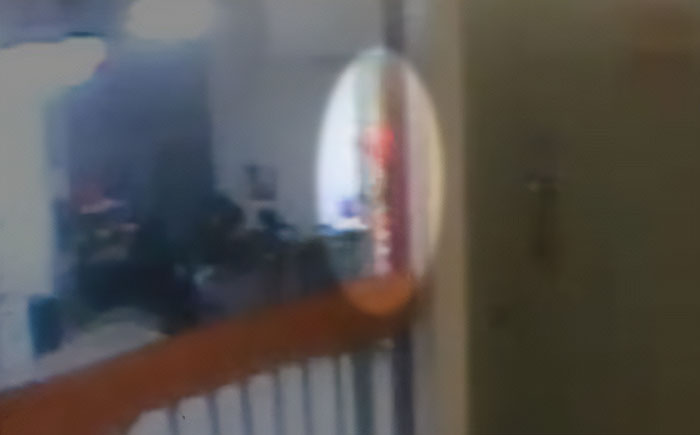 Doctor pointing at a blurry reflection during Jeffrey Epstein's post mortem, discussing how the disgraced financier passed. Doctor pointing at a blurry reflection during Jeffrey Epstein's post mortem, discussing how the disgraced financier passed.