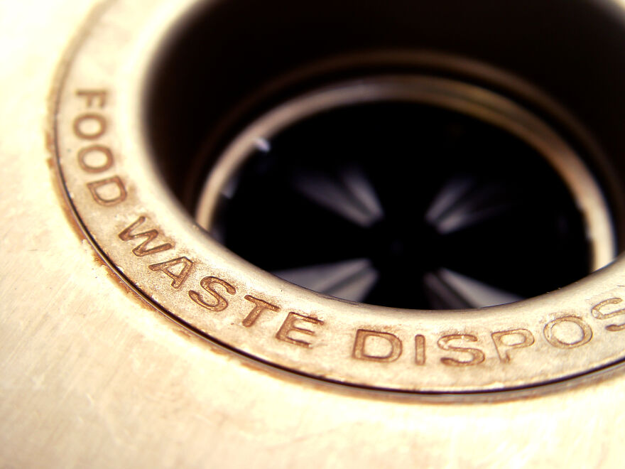 Close-up of a food waste disposer drain showcasing everyday items transformed with genius hacks for new life.