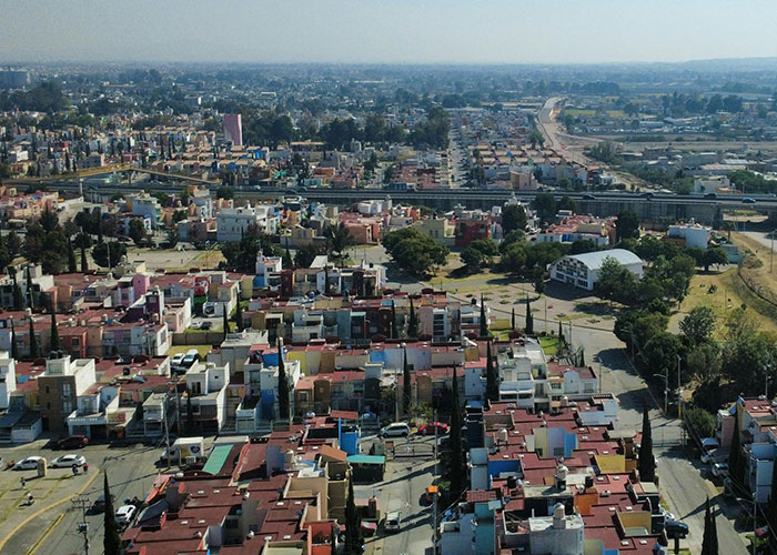 Aerial view of a city with colorful houses and buildings, showcasing unique things countries have that just make sense.