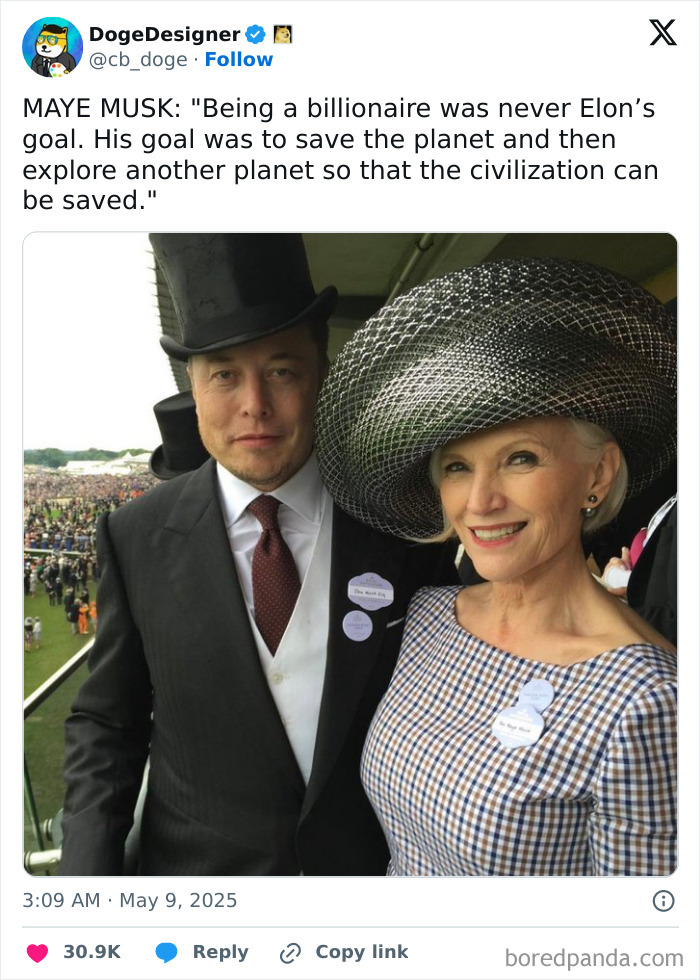 Two people dressed formally with large hats, a cringe moment captured at an event with a large crowd in the background.