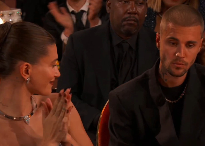 Justin Bieber showing tense body language during a moment analyzed by a body language expert on stage. Justin Bieber showing tense body language during a moment analyzed by a body language expert on stage.