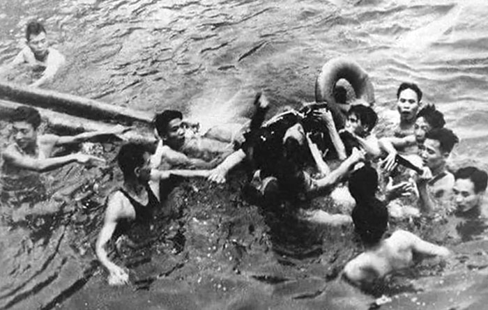 Group of young men in water engaging in a coordinated activity, a rare and intriguing photo capturing history between headlines