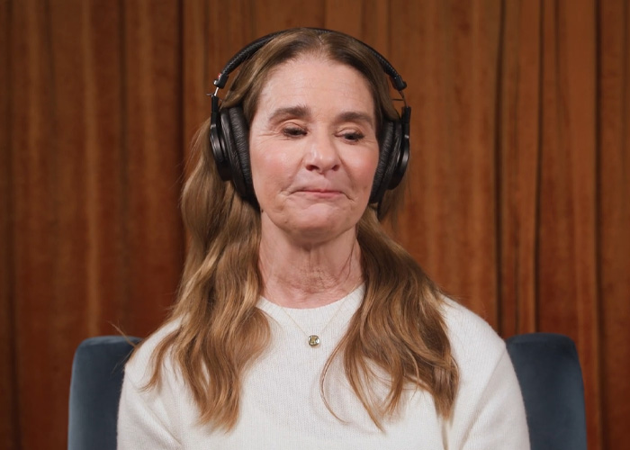 Melinda Gates wearing headphones, giving a pointed response about forgiving Bill amid Epstein files STD allegations.